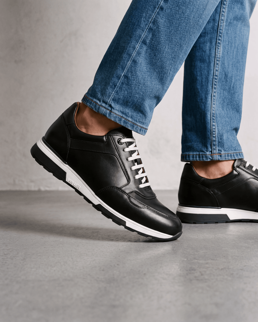 Zwart gladleren Positano sneaker – gedragen tijdens het lopen